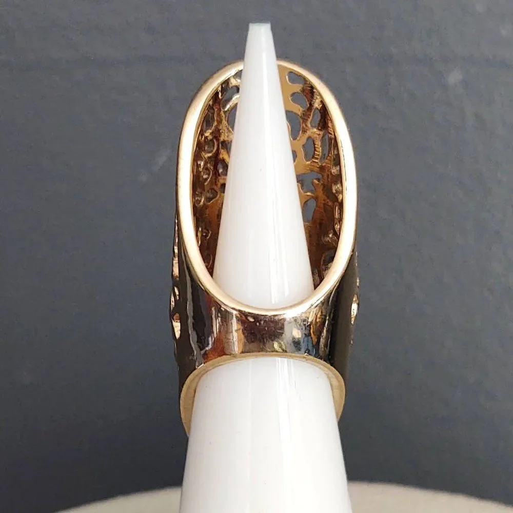Long, open scroll design gold ring